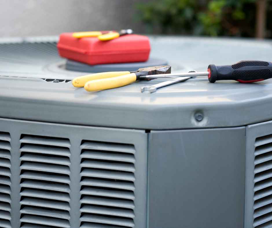 Tools on an air conditioner for repair | Robert B. Payne